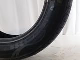 a close up of a tire on a white surface