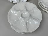 many plates that are sitting on a table