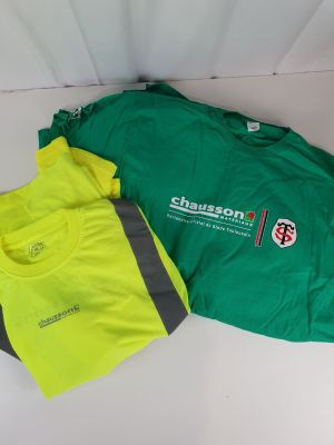 two t - shirts that are sitting on a table