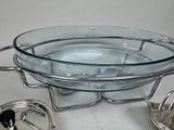 a glass bowl with a lid and a metal strainer