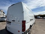 a white van that is parked in a parking lot