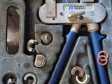 many tools in a tool box on the floor