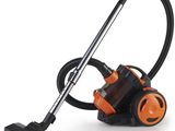 un aspirateur noir et orange sur fond blanc