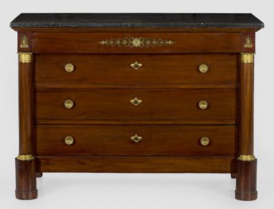 a small chest of drawers with a marble top
