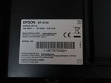 a close up of the back of a laptop with a label on it
