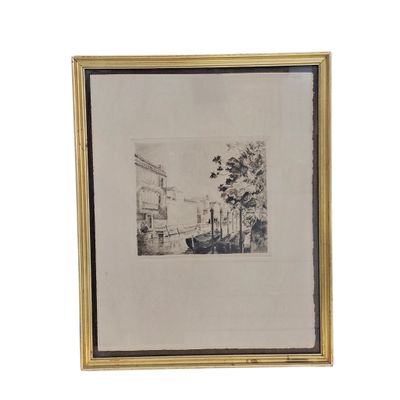 a black and white drawing of a street scene in a gold frame