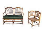 two chairs and a bench that are sitting next to each other