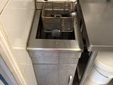 an image of a commercial kitchen with a deep fryer