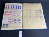 a close up of a book with stamps on it on a table