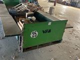 a green box with a number on it sitting in a warehouse