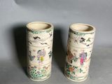 two vases that are sitting on a table