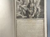 an open book with a drawing of jesus holding a child