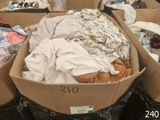 many boxes of clothes that are sitting in a store
