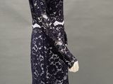 an image of a mannequin wearing a black lace dress