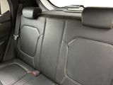 the back seat of a car with a seat belt in the back