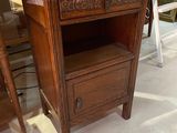 a small wooden table with a drawer on top of it