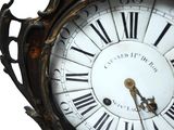 a close up of a clock with roman numerals on it