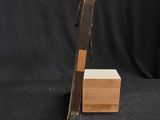 an old book sitting on top of a wooden box on a black background