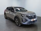 a grey suv parked in a room with a white wall