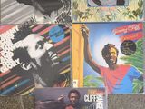 several different album covers of a man with a beard and a red shirt