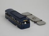 a toy bus that is sitting on a white surface