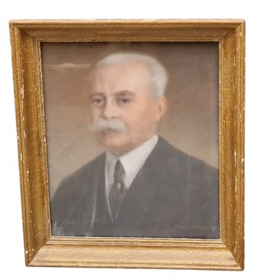 portrait of a man in a suit and tie in a gold frame