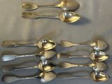 five spoons and two spoons on a table