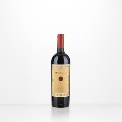 a bottle of red wine sitting on top of a table