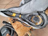a bag with a vacuum and a dust collector inside of it
