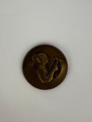 a gold coin with a picture of a man on it