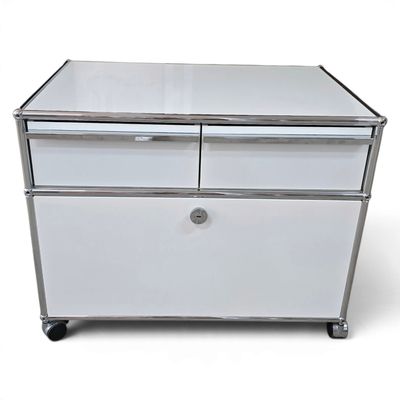 an image of a white chest of drawers on wheels
