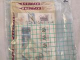 a bag of stamps and a pair of scissors on a table