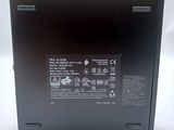 the back of a black laptop with a battery on top of it