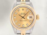 an image of a gold and silver rolex watch with diamonds