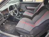 a car that has two seats and a steering wheel in it