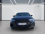 the front view of a blue audi car in a white room