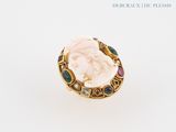 an image of a ring with a woman ' s face on it