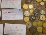a lot of coins that are on the table