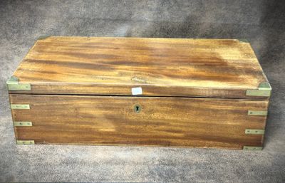an old wooden box sitting on top of a carpeted floor