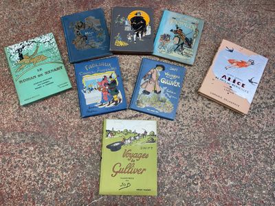 several children ' s books are laid out on the ground