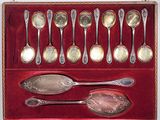 silver spoons in a red box with red velvet lining
