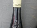 two bottles of wine that are on a table
