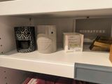a shelf that has a lot of items on it