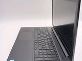 a laptop computer sitting on a table with a keyboard