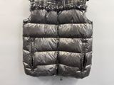 an image of a shiny vest hanging on a wall