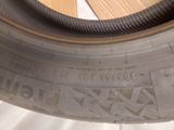 a close up of a tire on a white surface