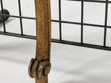 a close up of the legs of a chair on a white surface