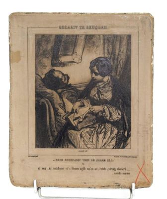 un vieux livre sur lequel figure le dessin d'une femme tenant un bébé dans ses bras