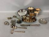 a lot of silver items that are on the table