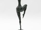 an image of a bronze statue of a woman on a marble base